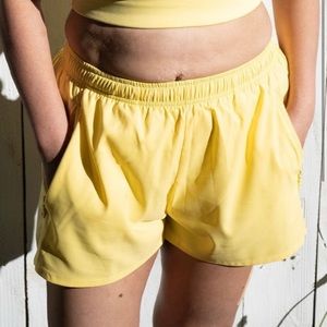NWOT Girlfriend Collective Gazelle shorts. Yellow. Large